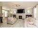 Cozy living room features a stone fireplace, a mounted TV, and comfortable seating with neutral colors at 1274 Old Heritage Pl, Greenwood, IN 46143