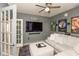 Living room with a large sectional sofa, movie posters, and open doorway at 1274 Old Heritage Pl, Greenwood, IN 46143