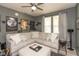 Comfortable living room with a large sectional sofa, ceiling fan and recessed lighting at 1274 Old Heritage Pl, Greenwood, IN 46143
