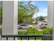 A view from the balcony of a street with houses and cars under a canopy of trees at 12833 Tradd St # 1B, Carmel, IN 46032