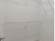 Walk-in closet with white walls and wire shelving at 12833 Tradd St # 1B, Carmel, IN 46032