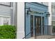 Close-up of front entrance shows address and black doors for the building at 12833 Tradd St # 1B, Carmel, IN 46032