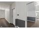 Bright, clean hallway with wall and floor detail and unit doors at 12833 Tradd St # 1B, Carmel, IN 46032