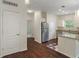 Clean kitchen with stainless steel appliances, granite countertops, and an adjacent dining area at 12833 Tradd St # 1B, Carmel, IN 46032