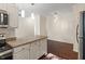 Kitchen showcases granite counters, white cabinets, stainless appliances, and pendant lighting at 12833 Tradd St # 1B, Carmel, IN 46032