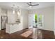 A bright, modern living room featuring an open layout, stainless steel appliances, and a balcony at 12833 Tradd St # 1B, Carmel, IN 46032