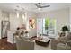 A bright, modern living room featuring an open layout, stainless steel appliances, and a balcony at 12833 Tradd St # 1B, Carmel, IN 46032