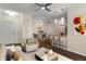 Stylishly furnished living room with bar seating, modern lighting, and a comfortable seating area at 12833 Tradd St # 1B, Carmel, IN 46032