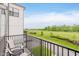 Balcony with table and chairs, overlooking the expansive backyard at 12990 Moultrie St, Carmel, IN 46032