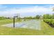 Community basketball court perfect for outdoor fun and recreation by the nearby pond at 12990 Moultrie St, Carmel, IN 46032