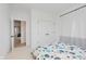 Bedroom with white walls, carpeted floor, and closet with double doors at 12990 Moultrie St, Carmel, IN 46032