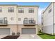 Exterior elevation features a balcony and an attached garage at 12990 Moultrie St, Carmel, IN 46032