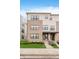 Modern townhouse with a combination brick and siding exterior and manicured lawn at 12990 Moultrie St, Carmel, IN 46032