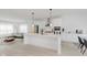 Bright kitchen features a large island, modern appliances, and an open-concept design at 12990 Moultrie St, Carmel, IN 46032