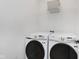 Laundry room with front load washer and dryer plus a storage shelf at 12990 Moultrie St, Carmel, IN 46032