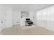 Modern office with light wood floors, white walls, and minimalist decor at 12990 Moultrie St, Carmel, IN 46032