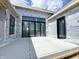 Exterior shot featuring large windows and a patio under construction, highlighting modern architecture and design at 1415 Beaumont Cir, Westfield, IN 46074