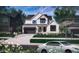 Charming two-story home with a two car garage, brick accents, and a manicured lawn at 1415 Beaumont Cir, Westfield, IN 46074