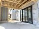 Outdoor patio shows black framed accordion style folding doors providing a modern aesthetic with ample light at 1415 Beaumont Cir, Westfield, IN 46074