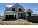 New construction home, framing complete, awaiting exterior finishes, showcasing modern design at 1415 Beaumont Cir, Westfield, IN 46074