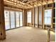 Inviting room under construction with large sliding glass doors and multiple windows flooding the space with natural light at 1415 Beaumont Cir, Westfield, IN 46074