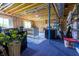 Unfinished basement with blue carpet, offering customization potential for storage and creativity at 1472 Maple Ridge Ct, Columbus, IN 47201