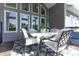 Covered deck with outdoor dining and seating, perfect for entertaining or enjoying the view at 1472 Maple Ridge Ct, Columbus, IN 47201