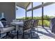 Relaxing covered deck space with outdoor dining set and a scenic view of the surrounding landscape at 1472 Maple Ridge Ct, Columbus, IN 47201