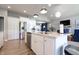 Bright, open kitchen featuring a large island, stainless steel appliances, and ample counter space at 1472 Maple Ridge Ct, Columbus, IN 47201