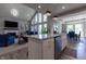 Open-concept living space featuring a kitchen with granite countertops and a fireplace at 1472 Maple Ridge Ct, Columbus, IN 47201