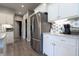 Well-lit kitchen featuring stainless steel appliances, white cabinets and granite countertops at 1472 Maple Ridge Ct, Columbus, IN 47201