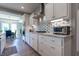 Bright kitchen with granite countertops, mosaic backsplash, and stainless steel appliances at 1472 Maple Ridge Ct, Columbus, IN 47201