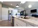 Open-concept kitchen with a granite island and stainless steel appliances at 1472 Maple Ridge Ct, Columbus, IN 47201