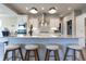 Kitchen island with granite countertop, pendant lighting, and seating for four at 1472 Maple Ridge Ct, Columbus, IN 47201