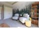 Stylish office featuring comfortable chairs, unique forest-themed decor, and ample storage at 1472 Maple Ridge Ct, Columbus, IN 47201