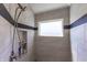 Modern walk-in shower with light gray tile, shower niche, and updated shower head fixture at 1472 Maple Ridge Ct, Columbus, IN 47201