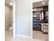 Organized walk-in closet featuring shelving, drawers, and ample storage space for clothes and accessories at 1472 Maple Ridge Ct, Columbus, IN 47201