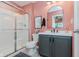 Bright bathroom featuring a shower with a glass door and a modern vanity with sink at 15143 Gallop Ln, Fishers, IN 46040