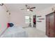 Bright bedroom featuring a bed, ceiling fan, window, and a small closet at 15143 Gallop Ln, Fishers, IN 46040