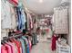 Walk-in closet featuring ample shelving and hanging space for clothing and accessories at 15143 Gallop Ln, Fishers, IN 46040