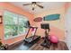 Bright and inviting exercise room featuring a treadmill, stationary bike, and natural light at 15143 Gallop Ln, Fishers, IN 46040