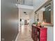 Inviting foyer with wood floors, large mirror, and a view into the open-concept living spaces beyond at 15143 Gallop Ln, Fishers, IN 46040