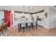 Stylish kitchen with white cabinetry, granite countertops, pendant lighting, and a modern island with bar seating at 15143 Gallop Ln, Fishers, IN 46040