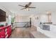 A bright second-story living room with hardwood floors, sofa, and staircase to other levels at 15143 Gallop Ln, Fishers, IN 46040