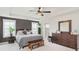 Comfortable main bedroom with large bed, dresser, and natural light from two windows at 15143 Gallop Ln, Fishers, IN 46040