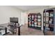 Home office with desk, monitor, and shelving units for storage and decoration at 15143 Gallop Ln, Fishers, IN 46040