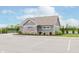Well-maintained pool house featuring stone accents, landscaped grounds, and designated parking at 15143 Gallop Ln, Fishers, IN 46040