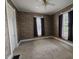 Bedroom with neutral carpet, two windows and ceiling fan at 152 1St W St, Shelbyville, IN 46176