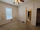 Bedroom features a ceiling fan, and natural light from a window, providing a cozy and peaceful atmosphere at 152 1St W St, Shelbyville, IN 46176