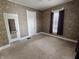 Cozy bedroom with neutral carpet and a mirrored closet at 152 1St W St, Shelbyville, IN 46176